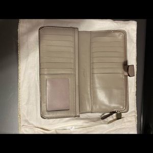 Coach wallet taupe with multiple storage areas